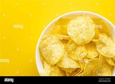 Crunchy Potato Chips Potato Crisps On Yellow Background Top View