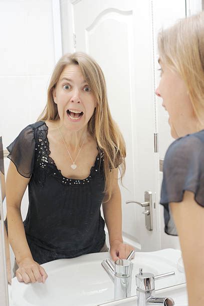 Older Woman Looking At Body In Mirror Stock Photos Pictures And Royalty