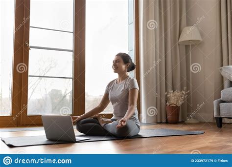 Serene Indian Female Trainer Lead Online Yoga Meditation Class Stock