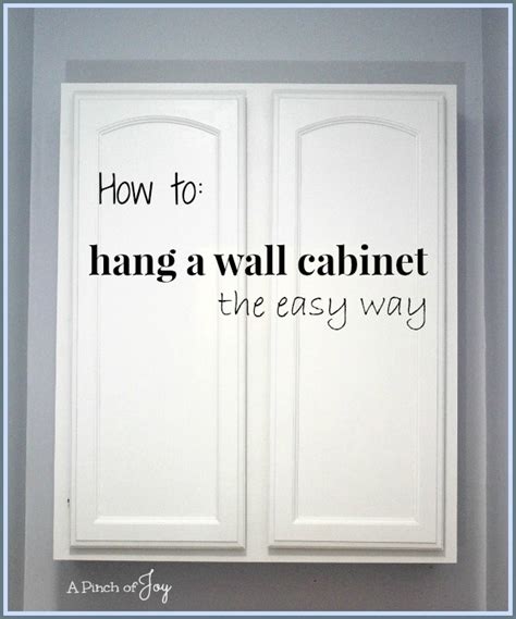 How To Hang A Wall Cabinet The Easy Way Pinch Of Joy