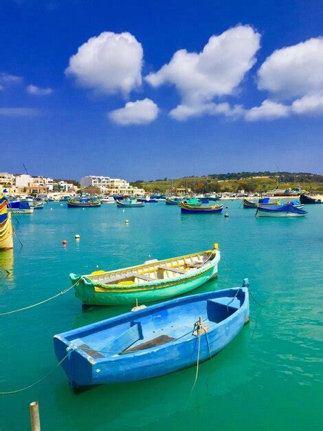 Premium Photo Sailboats Moored On Sea Against Sky