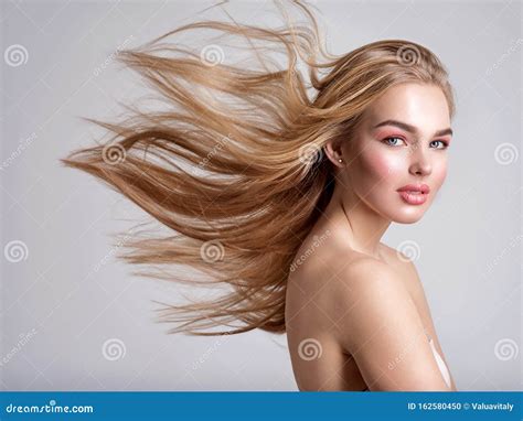 Portrait Of A Blonde Beautiful Woman With A Long Straight Light Hair