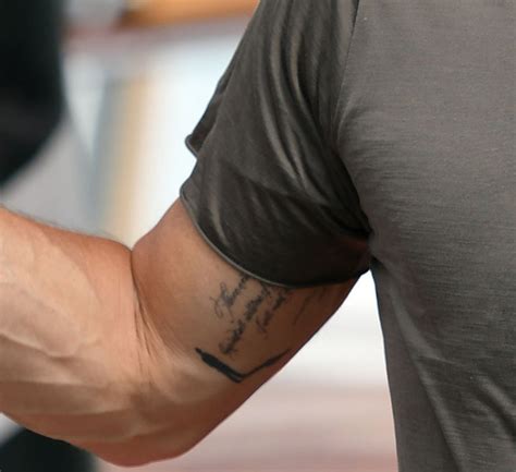 Pitbull Singer Arm Tattoos