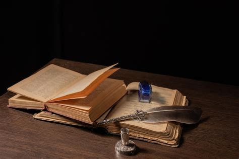 Premium Photo Quill Pen And Inkwell Resting On An Old Book Concept