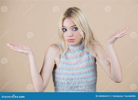 Confused Beautiful Blonde Woman With Questioning Gesture Girl