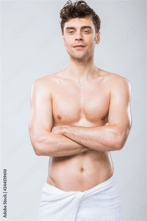 Handsome Shirtless Man In Towel Posing With Crossed Arms Isolated On