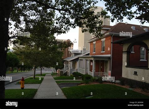 Downhill Sidewalk Crossing Lawns Front Red Brick Grey Wall Shingles