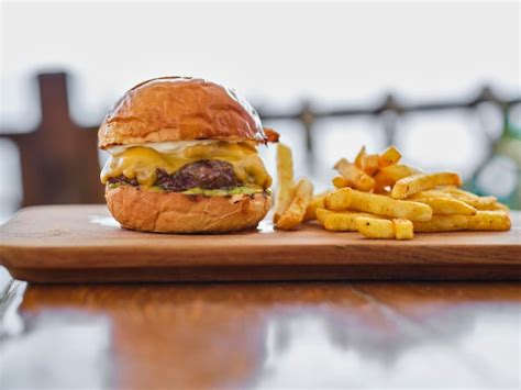 Premium Photo Delicious Cheeseburger And French Fries