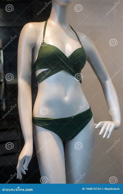 Green Bikini On Mannequin In Fashion Store Showroom For Women Stock