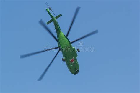 A Military Bright Green Helicopter with Red Star on the the Bottom Flying in the Sky Stock Image ...