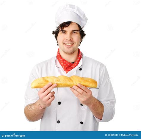Le Jeune Boulanger Tient Un Pain Photo Stock Image Of Masculin