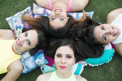 Premium Photo High Angle View Of Beautiful Women Lying Down On The Grass