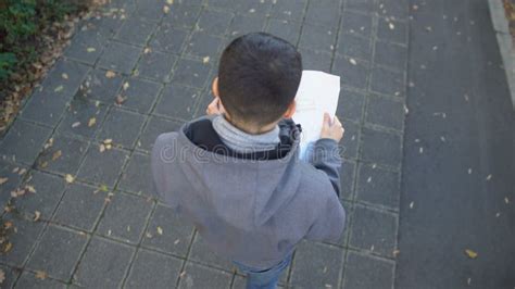 Male Tourist with City Map Walking on Street, Looking for Famous ...