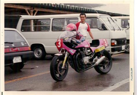 Man Riding A Pink Motorcycle