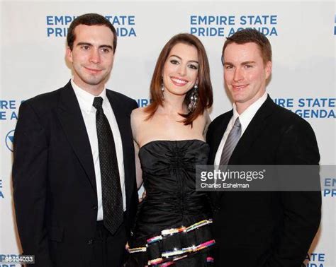 Actress Anne Hathaway with her brothers Thomas Hathaway and Michael ...