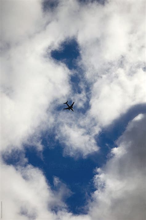 Airplane Between The Clouds Del Colaborador De Stocksy Marcel Stocksy