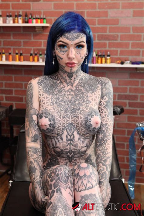 Inked Babe With Blue Hair Poses At The Tattoo Shop Photos