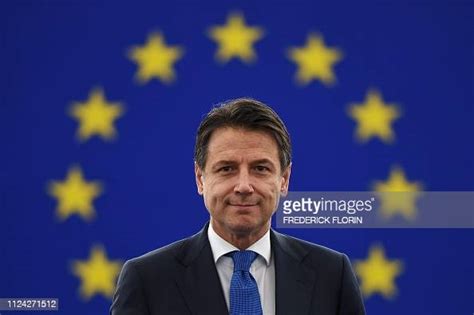 Italys Prime Minister Giuseppe Conte Looks On As He Arrives For A