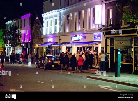 People Gathered Outside Nightclubs And Bars In Norwich Uk Stock Photo