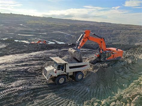 Excavator And Dump Truck Working In Coal Mine Area Stock Image Image