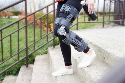 Premium Photo Woman Wearing Knee Brace Or Orthosis After Leg Surgery