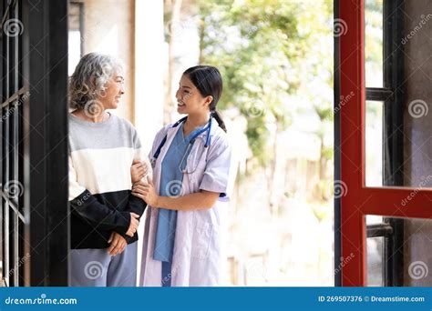 Young Caregiver Helping Senior Woman Walking Nurse Assisting Her Old