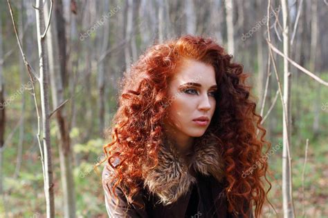 Beautiful Woman With Curly Hair In Leather Jacket Poses Stock Photo