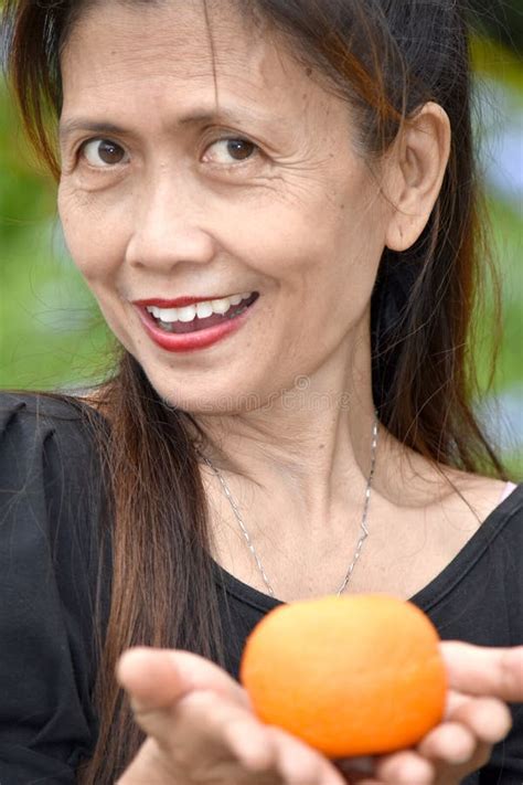 Older Filipina Female Senior Saluting Stock Photo Image Of Mature