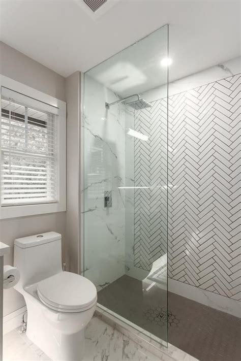 Bathroom Features Shower With White Herringbone Accent Wall Tiles With