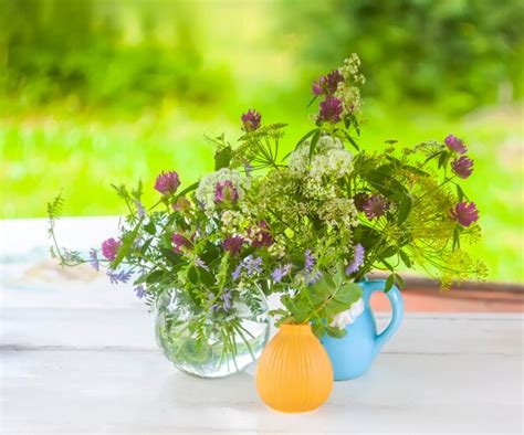 Premium Photo Summer Flowers In A Vase Outdoors