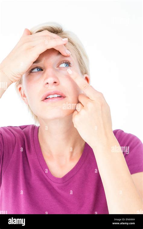 Blonde Applying Contact Lens Stock Photo Alamy