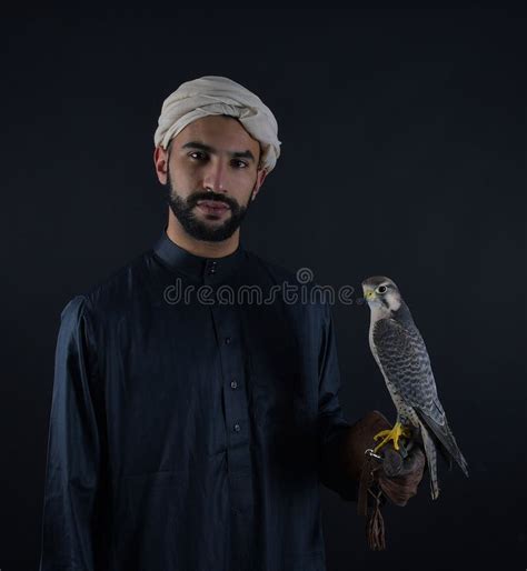 Young Falconer Holding A Bird Of Prey Stock Photo Image Of Fast