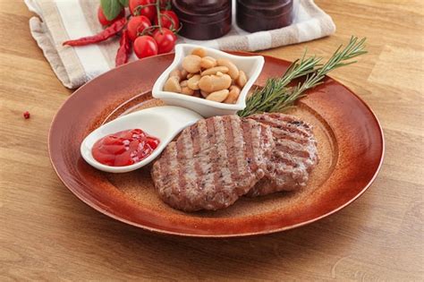 Premium Photo Grilled Beef Burger Cutlet With Sauce And Beans