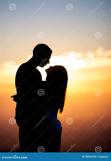 Silhouette Of Couple Kissing In Sunset Stock Photo - Image: 33924750