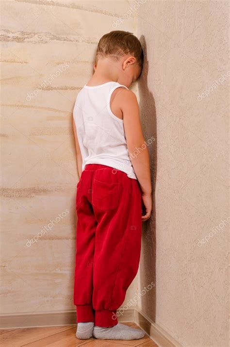 Little Boy Standing In A Corner Sulking — Stock Photo © Ampack 51195137