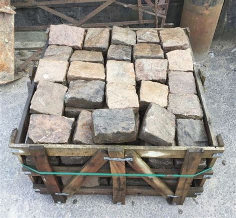 A Wooden Crate Filled With Lots Of Bricks