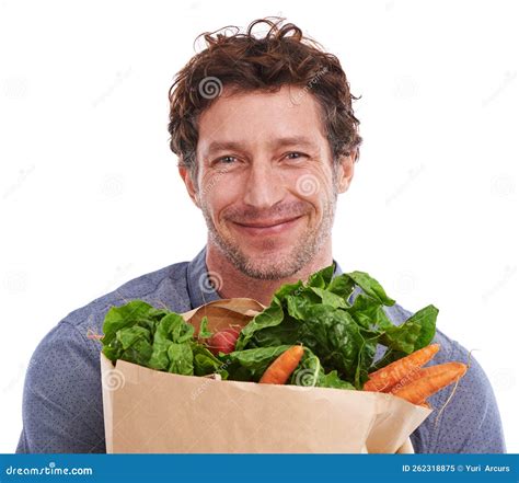 Bringing Home The Veggies Studio Portrait Of A Handsome Young Man