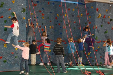 Principal Shows Rock Climbing Skills During Wall Dedication Ceremony