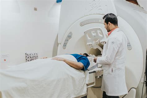 Doctor Examining Patient on MRI MachineFree Stock Photo