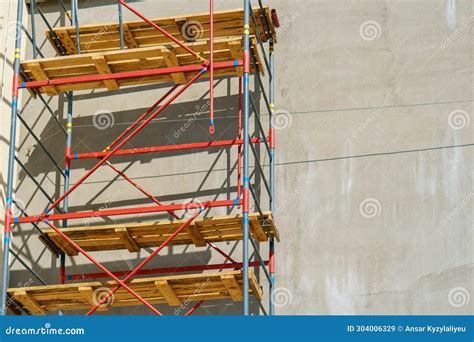 Scaffolding Is Installed Along The Wall Of The Building Under