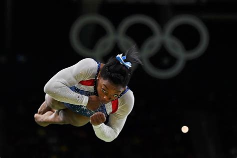 Two Photographs Of Simone Biles And Aly Raisman Flying Through The Air