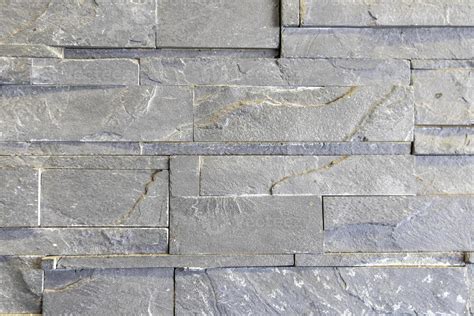 The stone wall is cut from small slabs to form a horizontal,Interior ...