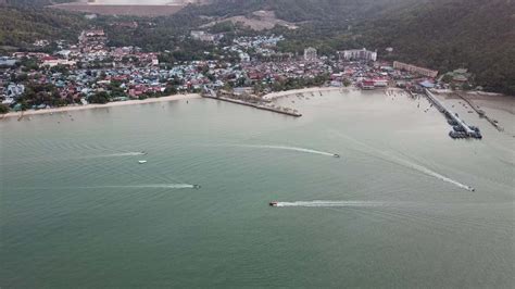 Boats sail at Teluk Bahang coastal 8619029 Stock Video at Vecteezy