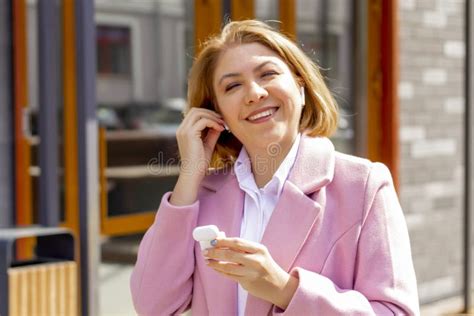 Close Up Portrait Of A Pretty Young Girl Wearing Wireless Headphones