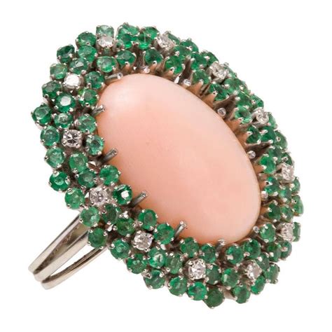 Angel Skin Coral Cocktail Ring With Emeralds And Diamonds Circa 1970