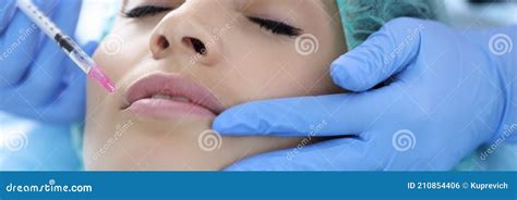 Beautician in Rubber Gloves Makes Collagen Injection into Lips of Young ...