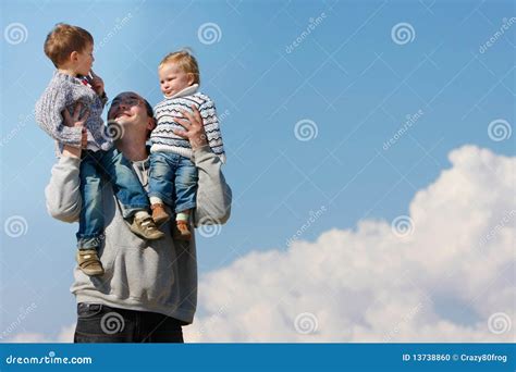 Father Holding Two Children On His Shoulders Stock Photo Image 13738860