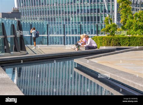 London, UK - July 16, 2019 - Tourists enjoying sunshine on the Garden ...