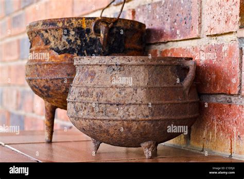 Traditional cast iron three-legged cooking pots from South Africa ...