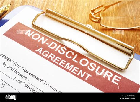 Confidentiality And Non Disclosure Agreement Form On A Desk Stock Photo